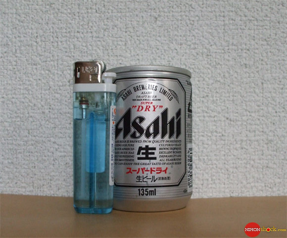 Tiny Japanese beer with lighter as size reference.